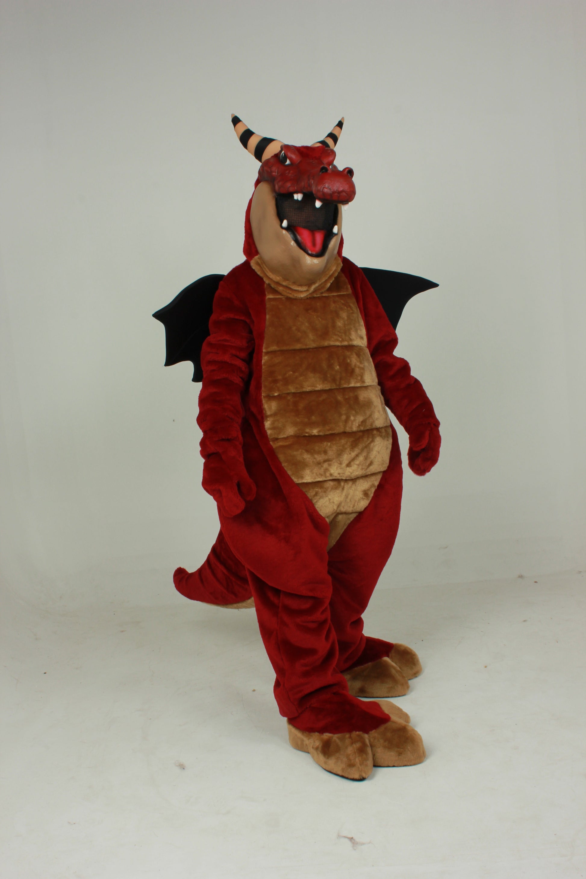 Crunch Dragon has horns, large open mouth for vision, fabric wings, and rounded body.
